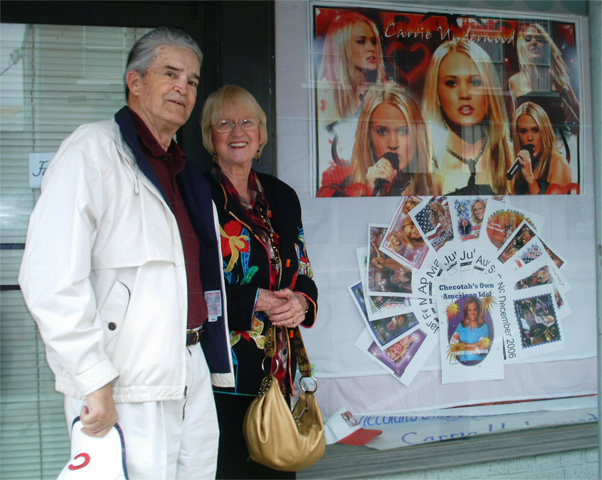 Dad and Jean in front of Carrie Underwood booster store in Checotah